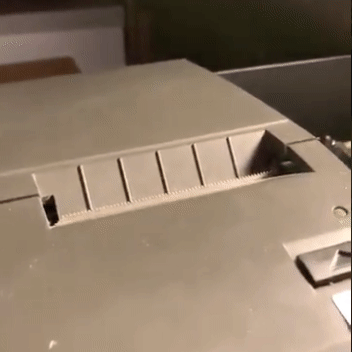 Animated image of a thermal printer printing tweets